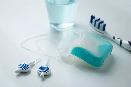 toothbrush, floss, and dental cleaning picks