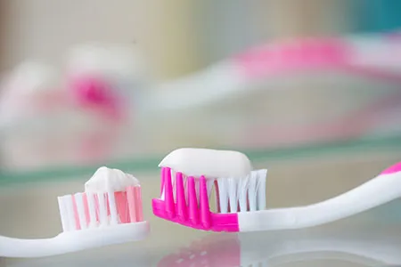 2 pink toothbrushes 