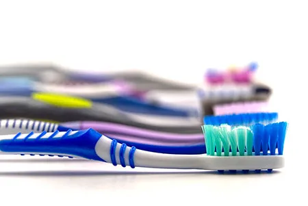 several colorful toothbrushes 